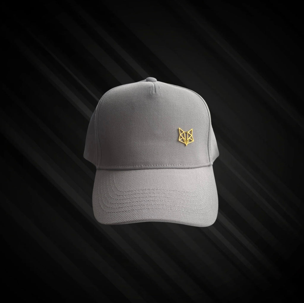 Light grey cap sun hat baseball peaked hat with gold coloured metal zillion fox logo Velcro strap
